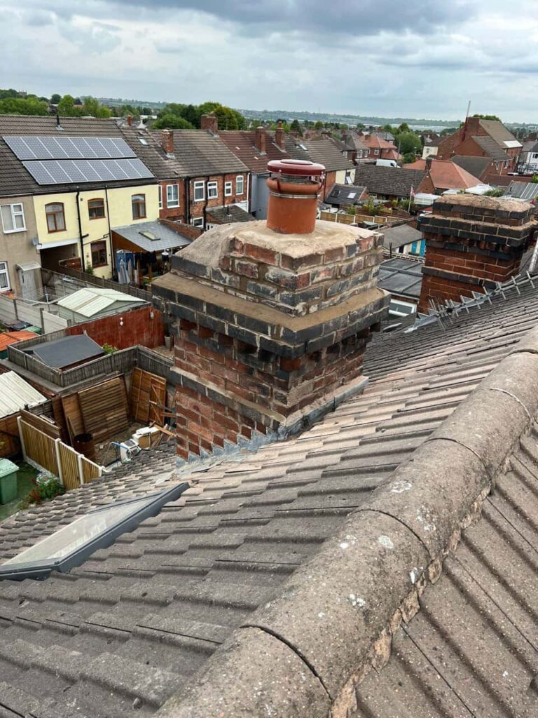 This is a photo taken from a roof which is being repaired by March Roofing Repairs, it shows a street of houses, and their roofs